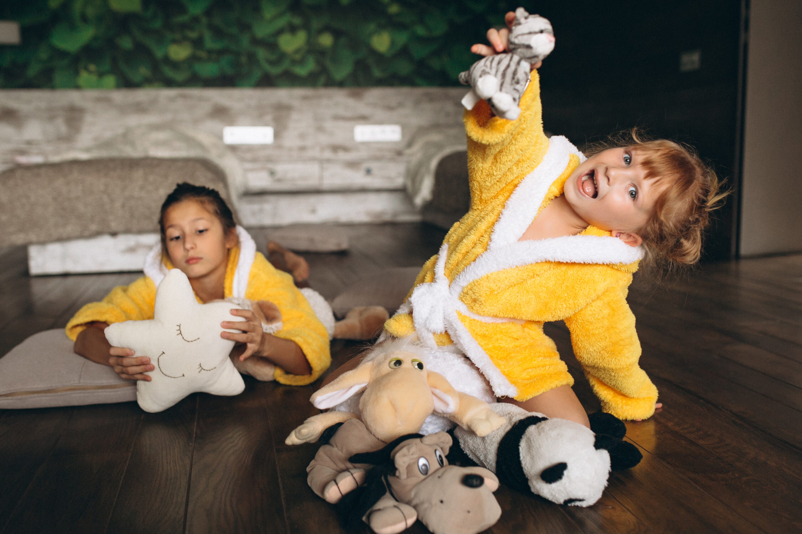 Sisters lying on floor