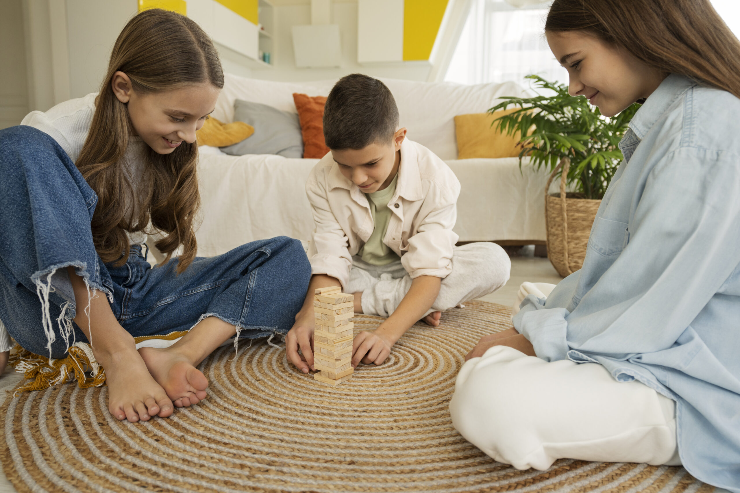 cousins-spending-time-together-home-playing-jenga